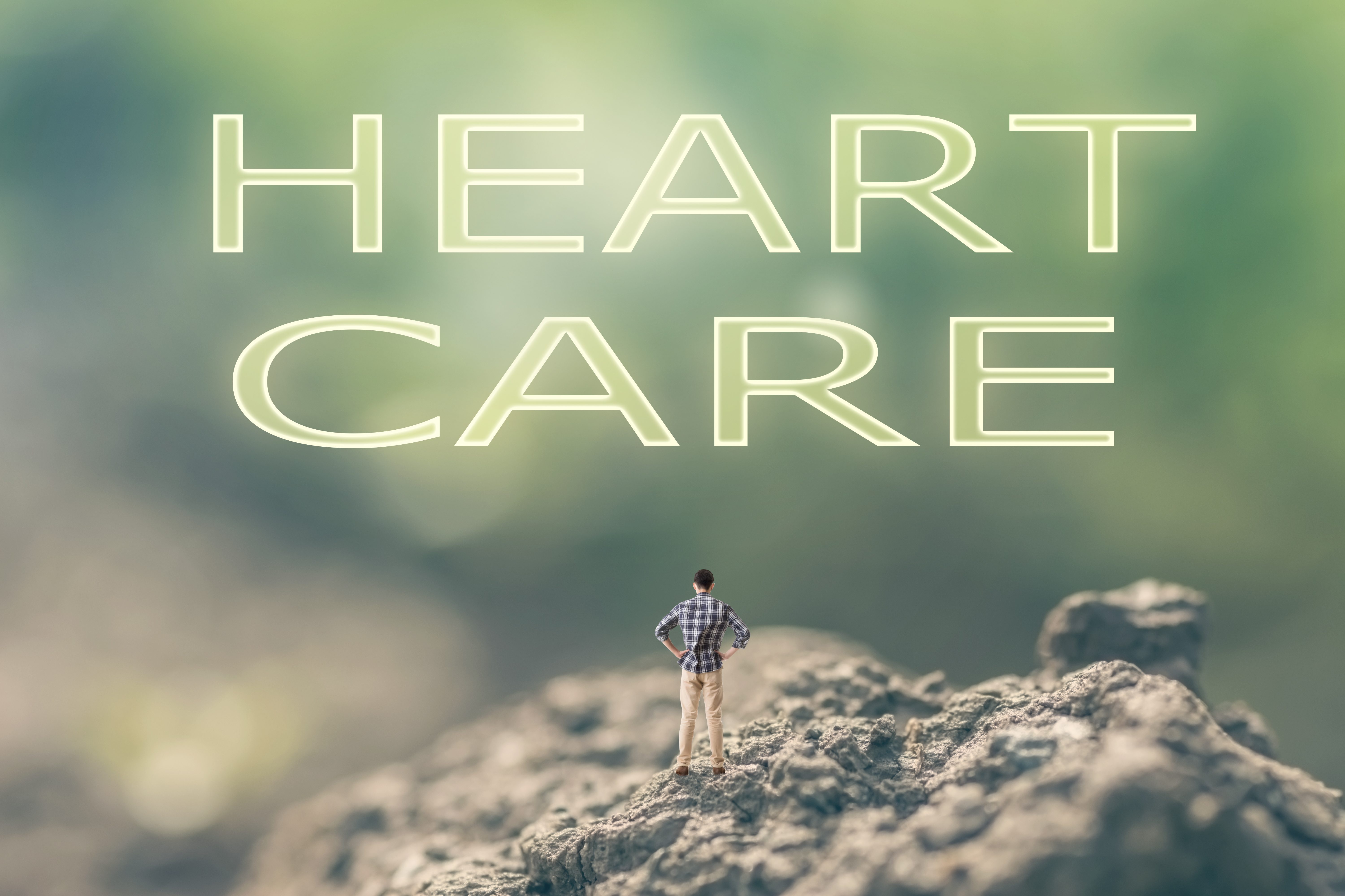 heart care graphic with tiny man on rocks